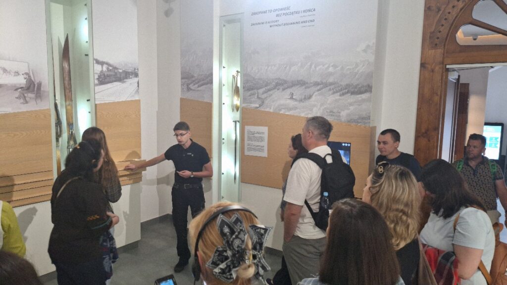 Photo 20. Participants learning about the history and traditions of the Goral (Highlander) culture during a visit to the Tatra Museum in Zakopane (2 July 2026). Photo 20. Participants learning about the history and traditions of the Goral (Highlander) culture during a visit to the Tatra Museum in Zakopane (2 July 2026).