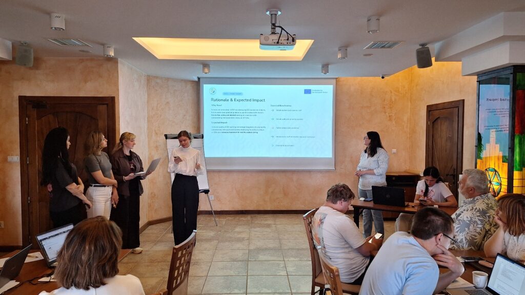 Photo 26. Team members (from left to right): Antonina Bulyna (Uzhhorod National University), Oksana Mararenko (The National University of Ostroh Academy), Svitlana Protska (Dragomanov Ukrainian State University), Yana Konok (Association of Sustainable Development Experts, Kyiv), and Valentyna Krykun (Hryhorii Skovoroda University in Pereiaslav) presenting their final group project “Methodological Recommendations for the Textbook "Education for Sustainable Development". Photo 26. Team members (from left to right): Antonina Bulyna (Uzhhorod National University), Oksana Mararenko (The National University of Ostroh Academy), Svitlana Protska (Dragomanov Ukrainian State University), Yana Konok (Association of Sustainable Development Experts, Kyiv), and Valentyna Krykun (Hryhorii Skovoroda University in Pereiaslav) presenting their final group project “Methodological Recommendations for the Textbook "Education for Sustainable Development".