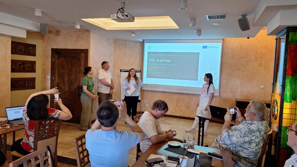 Photo 27. Team members (from left to right): Kovtun Oksana (Hryhorii Skovoroda University in Pereiaslav), Shevchuk Dmytro (The National University of Ostroh Academy), Yaloveha Anastasiia (Association of Sustainable Development Experts, Kyiv) and Haiovych Yevheniia (Uzhhorod National University), presenting their final group project “ESG Academy for Sustainable, Digital and Inclusive Education”. Photo 27. Team members (from left to right): Kovtun Oksana (Hryhorii Skovoroda University in Pereiaslav), Shevchuk Dmytro (The National University of Ostroh Academy), Yaloveha Anastasiia (Association of Sustainable Development Experts, Kyiv) and Haiovych Yevheniia (Uzhhorod National University), presenting their final group project “ESG Academy for Sustainable, Digital and Inclusive Education”.